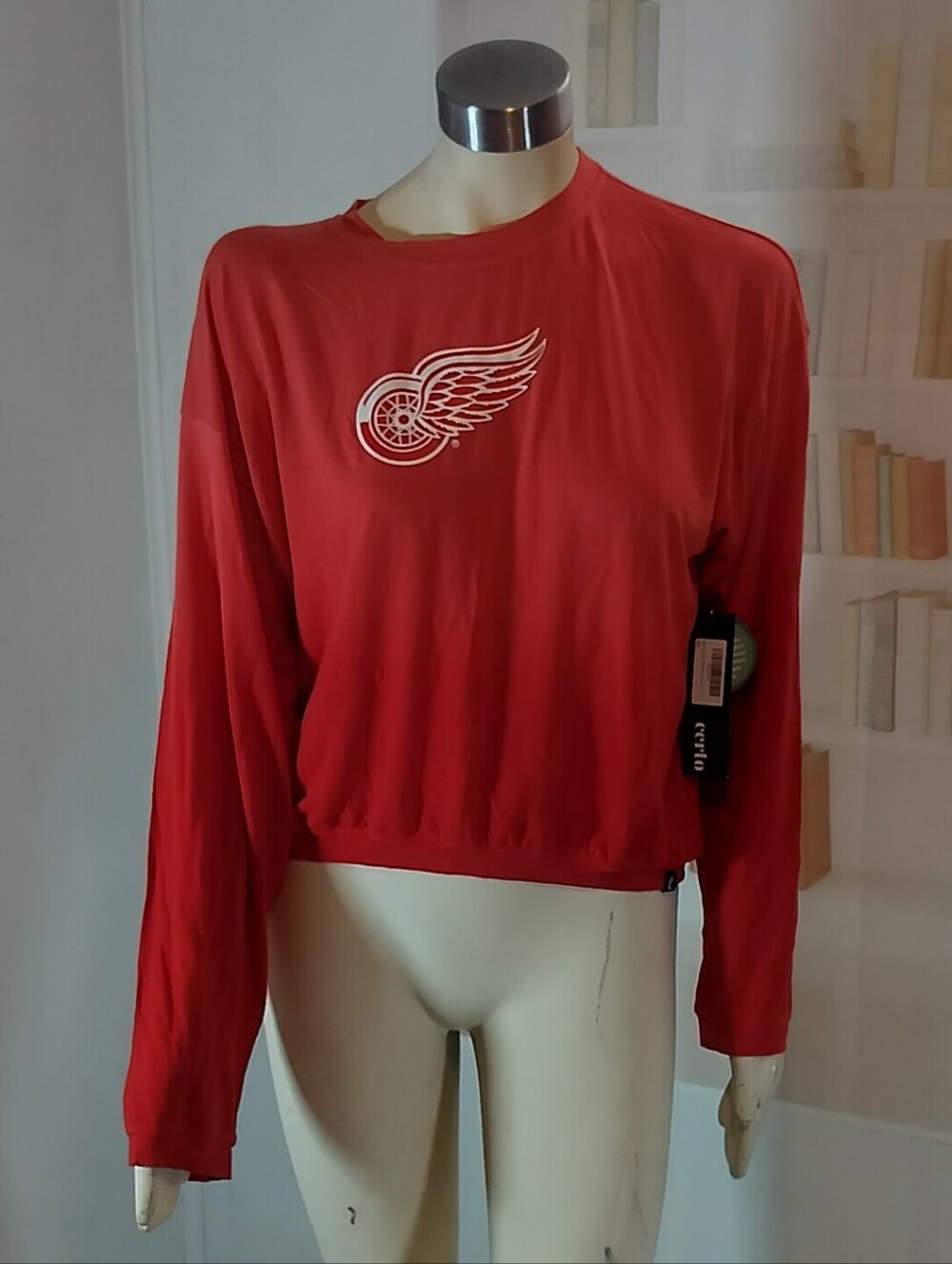 NHL Women's Red Cropped Long-Sleeve Pullover with Winged Wheel Logo